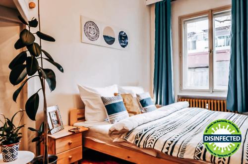 a bedroom with a bed and a window at TurnKey I Studio by City Mall in Prague