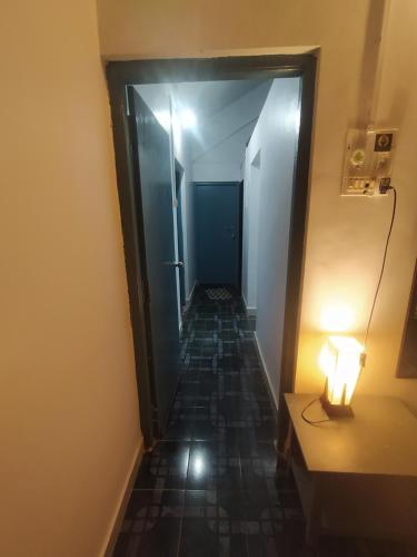 a hallway with a light on the end of a hallway at Casamore in Vagator