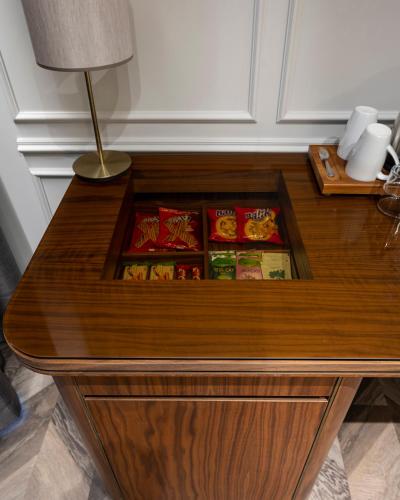 a wooden table with food in a drawer at Livro Hotel in Istanbul