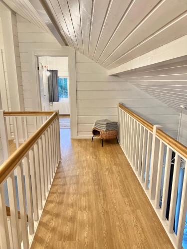 a room with a staircase with a ottoman in it at Jõiste Beach Villa in Jõiste