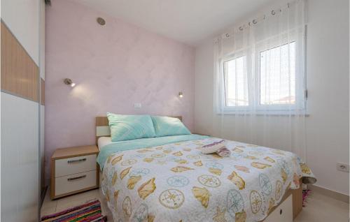 a small bedroom with a bed and a window at 1 Bedroom Nice Apartment In Vir in Vir