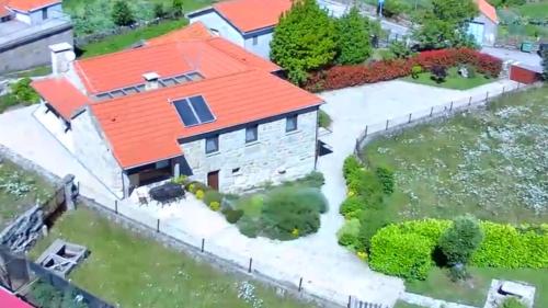 an aerial view of a house with an orange roof at Casa Fonte Do Laboreiro in Castro Laboreiro