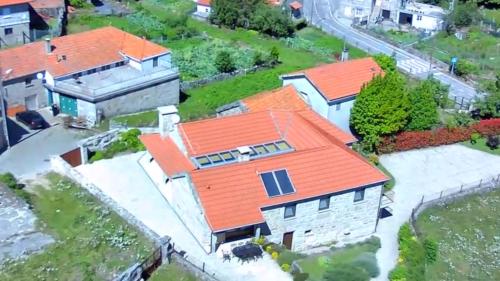an aerial view of a house with an orange roof at Casa Fonte Do Laboreiro in Castro Laboreiro