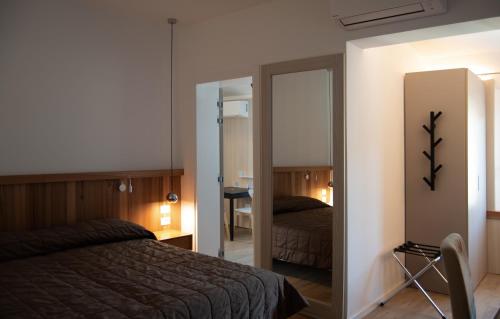 Un ou plusieurs lits dans un hébergement de l'établissement Hotel Oliva