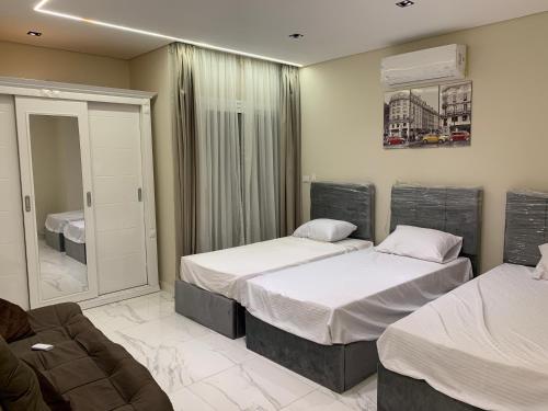 Cama o camas de una habitación en بيت السمو