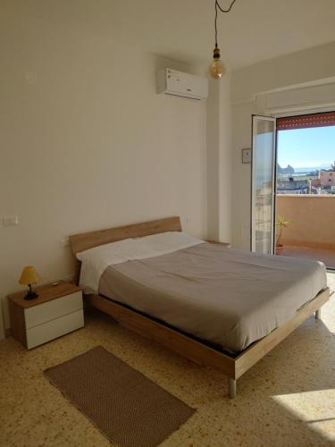 Ένα ή περισσότερα κρεβάτια σε δωμάτιο στο Casa Flegrea Bagnoli