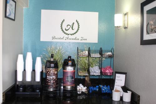 a counter with bottles of wine and candles on it at Bristol Arcadia Inn in Bristol