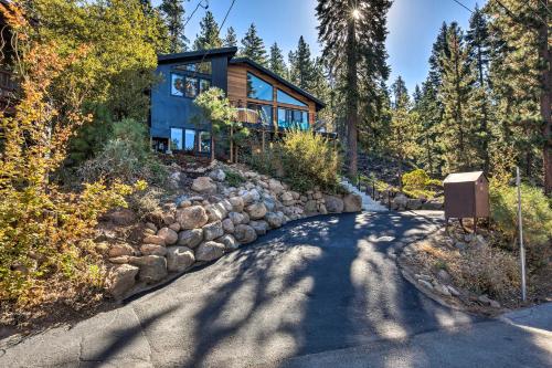 a house in the woods with a stone driveway at Private Hot Tub Family-Friendly Lake Tahoe House in Kings Beach