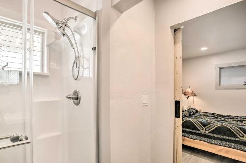 a bathroom with a shower and a bed at Sheridan Getaway Near Dtwn, Fishing and Hiking! in Sheridan