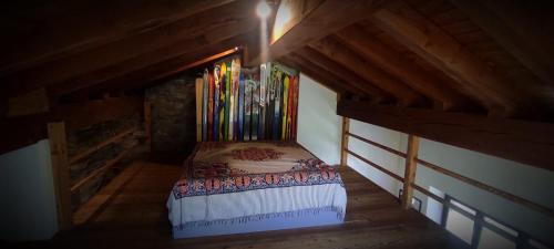 a small room with a bed in a attic at Vista Monterosa in Riva Valdobbia