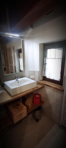 a bathroom with a sink and a mirror at Vista Monterosa in Riva Valdobbia