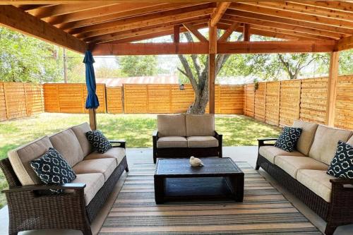 a patio with two couches and a coffee table at The Retreat at Rigsby-All new 3bdrm/2.5 bath in San Antonio