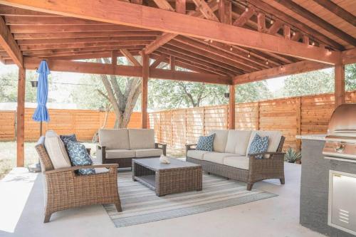 a patio with two couches and a grill at The Retreat at Rigsby-All new 3bdrm/2.5 bath in San Antonio