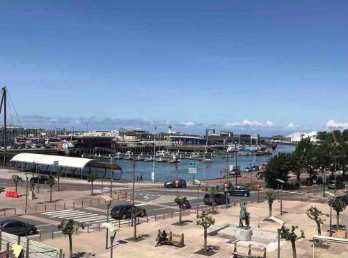 a marina with cars parked in a parking lot at NEW PROCHE NAUSICAA ! « Mille et Un Rêve » in Boulogne-sur-Mer