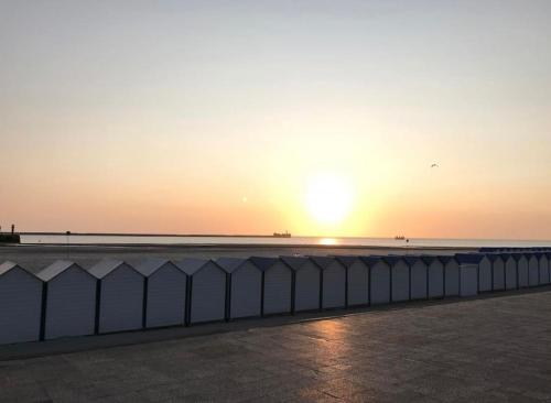 a fence in front of the ocean at sunset at NEW PROCHE NAUSICAA ! « Mille et Un Rêve » in Boulogne-sur-Mer