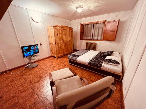 Кровать или кровати в номере La Baita Limone Riserva Bianca Ski-in Ski-out Seggiovia Morel 3