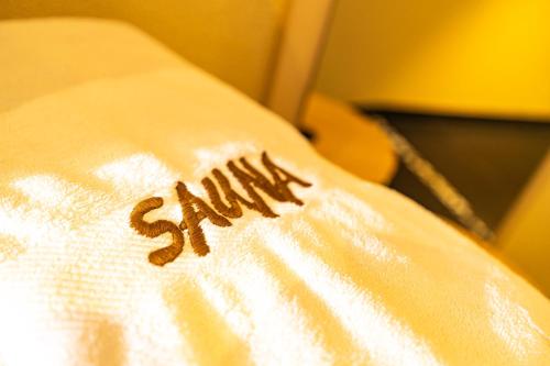a white pillow with the word spam written on it at Haus Anton Sölden - Apartments & Zimmer in Sölden