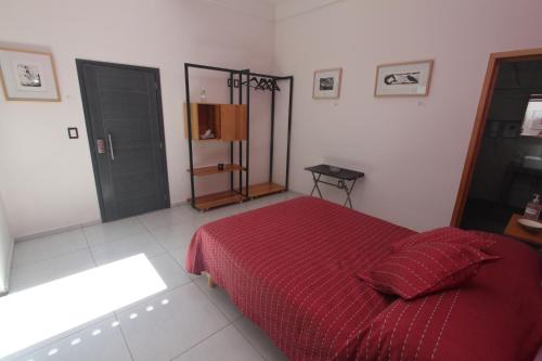 Postel nebo postele na pokoji v ubytování LARIMAR Gallery y Hotel Boutique