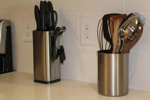 a metal container filled with utensils on a counter at Luxury in the Gulch in Nashville
