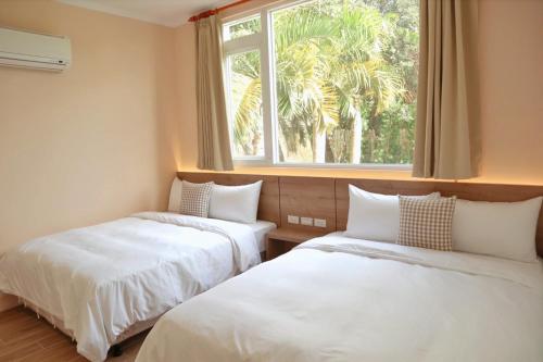 Ein Bett oder Betten in einem Zimmer der Unterkunft 純粹Home 民宿