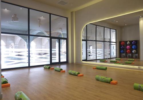 a gym with green and orange balls on the floor at Basqal Resort & SPA in Basqal