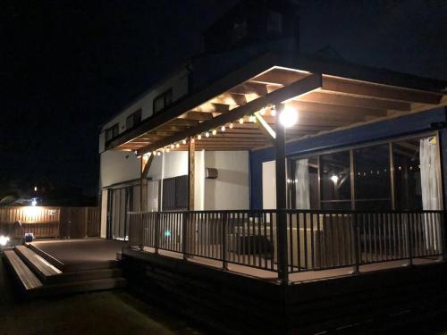 a building with lights on it at night at オーシャニア一宮 in Ichinomiya