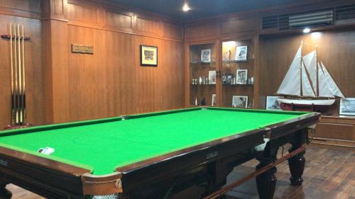 a pool table in a room with a boat at Mae Chan Treehouse with swimming pool in Mae Chan