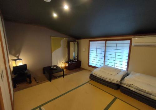 Kyoto Shirakawa Kiraku Innにあるベッド