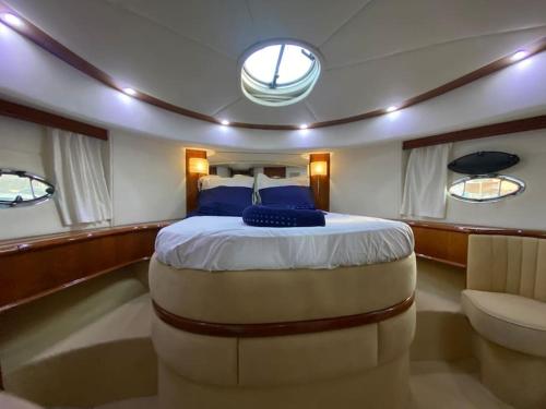 a large bed in the middle of a boat at Yacht le Yauta Porto Vecchio in Porto-Vecchio