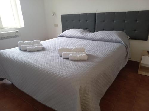 En eller flere senge i et værelse på La Casa di Nonna Romina