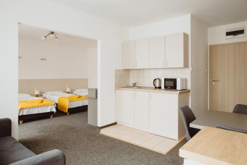 Postel nebo postele na pokoji v ubytování Arche Hotel Siedlce