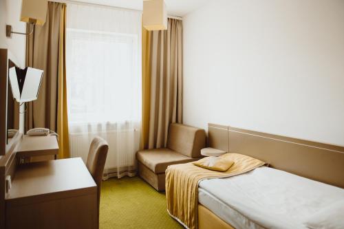 Ένα ή περισσότερα κρεβάτια σε δωμάτιο στο Arche Hotel Siedlce