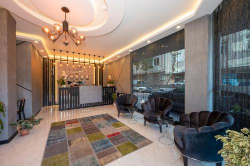 a lobby with chairs and a table in a building at Comfort Point in Istanbul