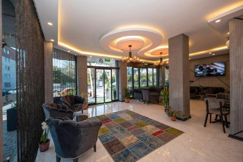 a lobby with chairs and a tv in a building at Comfort Point in Istanbul