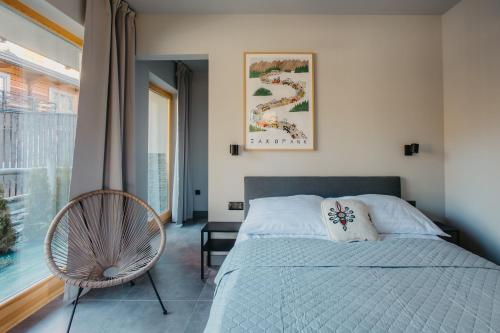 Posteľ alebo postele v izbe v ubytovaní Apartamenty Sobiczkowa