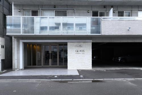 a building with a sign that says glass on it at GLASS Yamahana EAST in Minami-jūichijō
