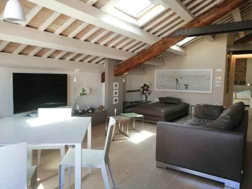 a living room with a couch and a table at CasaDei Home Design & Relax in Cervia