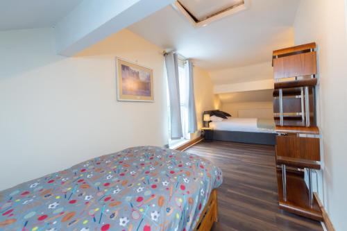a small room with a bed and a bedroom with a bed sqor at CYPRUS in Liverpool