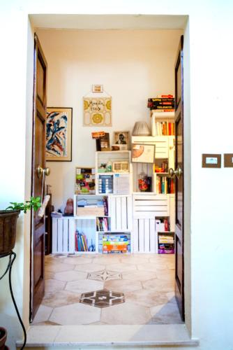 an open door to a room with books at ManillaHouse in Montepulciano