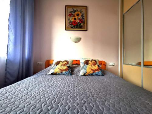 Gulta vai gultas numurā naktsmītnē Apartments by Daiva