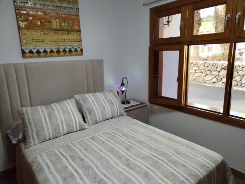 Postel nebo postele na pokoji v ubytování Casa Encarnación