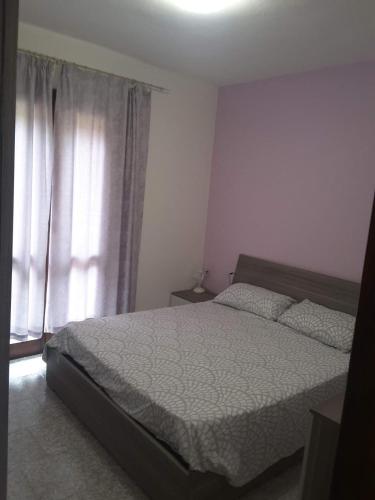 En eller flere senger på et rom på Appartamento Olbia Panoramica Mare