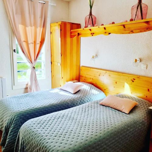 Posteľ alebo postele v izbe v ubytovaní Appartement avec piscine & jardin pied de la télécabine