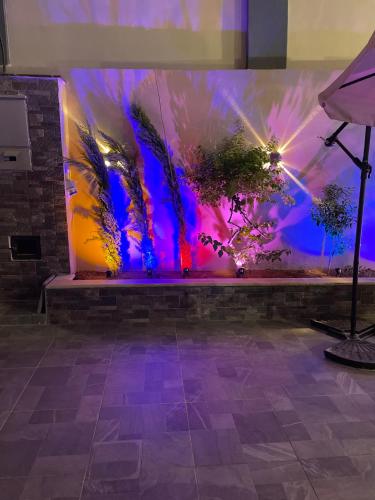 a wall with a painting of trees on it at Villa Jana chalet - Private Villa - Dead Sea - Jordan in Ash Shāghūr