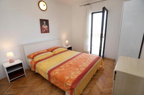 Postel nebo postele na pokoji v ubytování Apartman Karaga