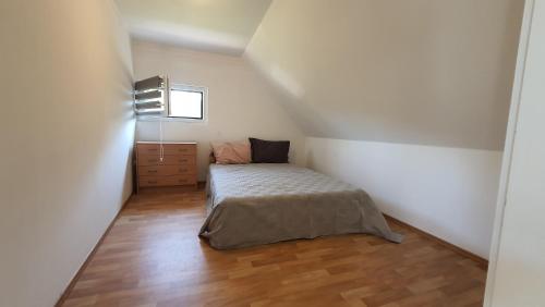 A bed or beds in a room at Y37 Apartmanok