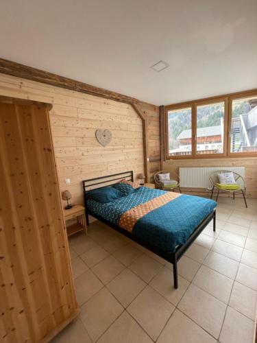 Ένα ή περισσότερα κρεβάτια σε δωμάτιο στο Terrasse sur les Aravis