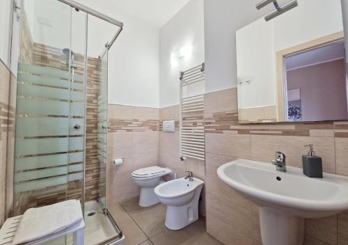 a bathroom with a sink and a toilet and a shower at B&B Viale San Pietro in Sassari