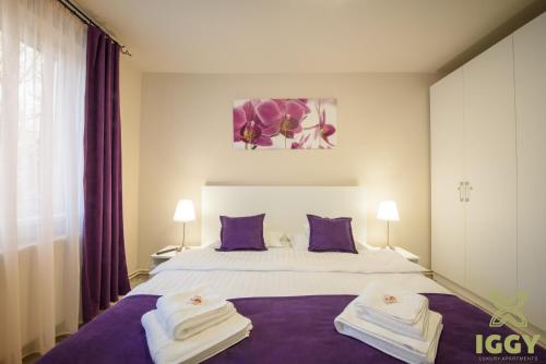 Postel nebo postele na pokoji v ubytování Iggy Luxury Apartment