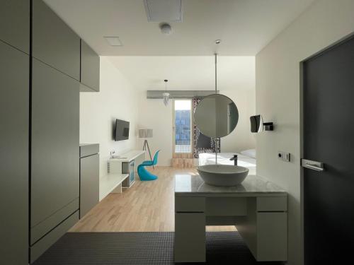 a bathroom with a sink and a mirror at Hotel Praha Liberec in Liberec